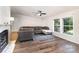 Bright and inviting living room features hardwood floors, large windows, and modern decor at 394 Link Dr, Iron Station, NC 28080