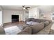 Spacious living room with hardwood floors, fireplace, and lots of natural light at 394 Link Dr, Iron Station, NC 28080