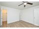 Bedroom featuring wood-look floors, ceiling fan, and closet at 402 Gibson Park Dr, Huntersville, NC 28078