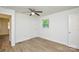 Bedroom features wood-look floors, ceiling fan, window and closet at 402 Gibson Park Dr, Huntersville, NC 28078
