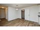 Open dining area showcasing new flooring, modern lighting, and seamless flow to the kitchen at 402 Gibson Park Dr, Huntersville, NC 28078