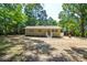 Charming one-story home with a brick exterior, neat landscaping, and well-maintained front yard at 402 Gibson Park Dr, Huntersville, NC 28078