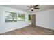 Bright living room with new floors, ceiling fan, and fresh paint with nice natural light at 402 Gibson Park Dr, Huntersville, NC 28078