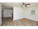 Well-lit living space showcasing modern flooring and fresh neutral paint and a view of the kitchen at 402 Gibson Park Dr, Huntersville, NC 28078