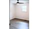 Bedroom with light wood-look floors, ceiling fan, and a window at 412 E Taylor St, Landis, NC 28088