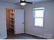Bedroom with wood-look floors, closet with shelving, and a window at 412 E Taylor St, Landis, NC 28088