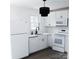 White kitchen featuring modern appliances and plenty of cabinet space at 412 E Taylor St, Landis, NC 28088