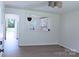 Bright, minimalist living room with wood floors and kitchen view at 412 E Taylor St, Landis, NC 28088