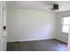Minimalist living room features light wood-look floors and modern lighting at 412 E Taylor St, Landis, NC 28088