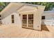 Exterior angle of the back deck, showing access to the home through French doors at 4226 Raney Way, Charlotte, NC 28205