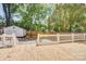 Spacious wooden back deck with white railings overlooking a lush, green yard at 4226 Raney Way, Charlotte, NC 28205