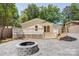 View of the back of the house, deck, and backyard fire pit area at 4226 Raney Way, Charlotte, NC 28205