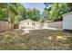 Large backyard with a deck and fire pit area, perfect for outdoor entertaining at 4226 Raney Way, Charlotte, NC 28205