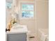 Stylish bathroom features a modern vanity, updated fixtures, and a window for natural light at 4226 Raney Way, Charlotte, NC 28205