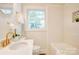 Charming bathroom with white subway tile, an alcove, and a modern vanity at 4226 Raney Way, Charlotte, NC 28205
