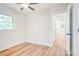 Clean bedroom with hard wood floors, a ceiling fan, and two entry ways at 4226 Raney Way, Charlotte, NC 28205