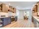 Well-lit kitchen featuring stainless steel appliances, modern countertops, stylish cabinets and a dining nook at 4226 Raney Way, Charlotte, NC 28205