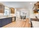 Spacious kitchen featuring a breakfast bar, modern appliances, and view into the dining room at 4226 Raney Way, Charlotte, NC 28205