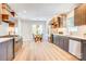 Modern kitchen with stainless steel appliances, custom cabinets, and an eat-in breakfast nook at 4226 Raney Way, Charlotte, NC 28205