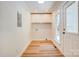 Clean and organized laundry room featuring a utility sink, storage cabinets, and natural light at 4226 Raney Way, Charlotte, NC 28205