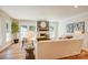 Bright living room featuring a fireplace, hardwood floors, and natural light, perfect for relaxation at 4226 Raney Way, Charlotte, NC 28205