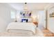 Bright and airy main bedroom with a plush king bed, and decorative lamps at 4226 Raney Way, Charlotte, NC 28205