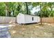 Detached garage/shed with a white exterior and neutral-colored backyard at 4226 Raney Way, Charlotte, NC 28205