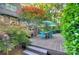 Spacious wooden deck with an outdoor dining area shaded by trees, great for gatherings at 4831 Antioch Church Rd, Matthews, NC 28104
