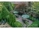 Spacious deck with dining tables and lounge chairs, surrounded by lush landscaping at 4831 Antioch Church Rd, Matthews, NC 28104