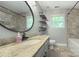 Well-lit bathroom featuring granite countertops, a stylish mirror, and modern fixtures at 4831 Antioch Church Rd, Matthews, NC 28104