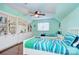 Comfortable bedroom with built-in shelving, hardwood floors, and two twin beds at 4831 Antioch Church Rd, Matthews, NC 28104