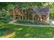 Stunning brick home featuring a beautifully landscaped front yard and attached garage at 4831 Antioch Church Rd, Matthews, NC 28104