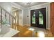 Welcoming foyer with elegant double doors and hardwood floors, creating a grand entrance at 4831 Antioch Church Rd, Matthews, NC 28104