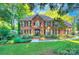Beautiful brick home with meticulously landscaped front yard and charming curb appeal at 4831 Antioch Church Rd, Matthews, NC 28104