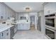 Updated kitchen features stainless steel appliances, sleek countertops, and plenty of cabinet space at 4831 Antioch Church Rd, Matthews, NC 28104