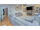 Inviting living room features a cozy stone fireplace, built-in bookshelves, and comfortable seating at 4831 Antioch Church Rd, Matthews, NC 28104