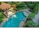 Aerial view of a stunning pool with a lounge area and lush landscaping at 4831 Antioch Church Rd, Matthews, NC 28104