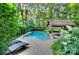 Lounge by the pool and enjoy the serene landscaping and covered cabana at 4831 Antioch Church Rd, Matthews, NC 28104