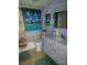 Well-lit bathroom featuring a tiled floor, shower with themed curtain, and a white vanity at 500 Steel Bridge Loop, Hickory, NC 28601