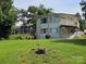 Beautiful home with unique architecture surrounded by lush green trees and a well-manicured lawn at 500 Steel Bridge Loop, Hickory, NC 28601