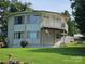 Waterfront home featuring multiple decks, a lush yard, and an American flag at 500 Steel Bridge Loop, Hickory, NC 28601