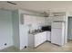 Functional kitchen with white cabinets, a stainless steel sink, and a refrigerator at 500 Steel Bridge Loop, Hickory, NC 28601