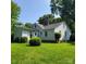 Rear view of a well-kept home with an expansive lawn and mature trees at 6908 Alexander Rd, Charlotte, NC 28270