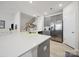 Modern kitchen featuring stainless steel appliances and a bright white quartz countertop at 7032 Everly Commons Ln, Tega Cay, SC 29708