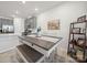 Eat-in kitchen with gray cabinets, a central island and stylish decor accents at 7032 Everly Commons Ln, Tega Cay, SC 29708