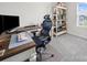 Comfortable home office setup with an ergonomic chair, a spacious desk, and ample storage, perfect for productivity at 7032 Everly Commons Ln, Tega Cay, SC 29708