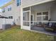 Relaxing screened porch with comfortable seating, providing a perfect outdoor living space at 7032 Everly Commons Ln, Tega Cay, SC 29708