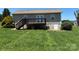 Rear view of a home showing the wooden deck and well-maintained backyard at 72 Helens Way, Taylorsville, NC 28681