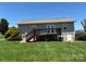 Backyard featuring a deck, manicured lawn, and mature landscaping at 72 Helens Way, Taylorsville, NC 28681