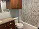 Bathroom featuring a dark vanity, a shower-tub combo and decorative shower curtain at 72 Helens Way, Taylorsville, NC 28681